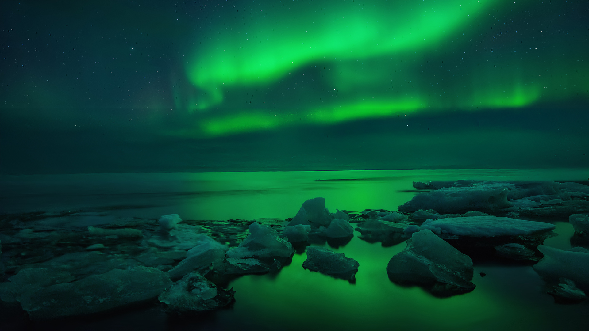northern lights over icey water
