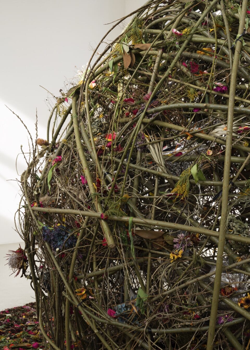 a close up image of a large orb-like installation made of flowers